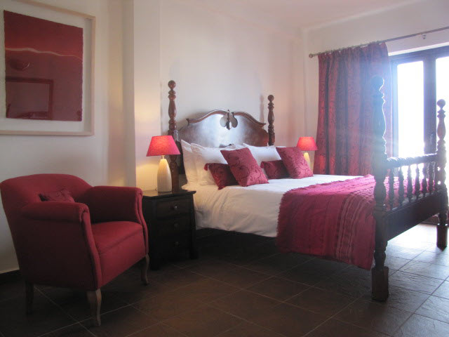 hotel-room-red-covers-and-red-seat