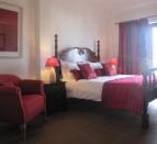 hotel-room-red-covers-and-red-seat